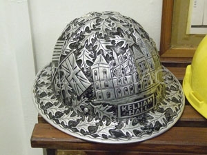 An oil worker's helmet from the 1940s bearing the picture and name of Kelham Hall